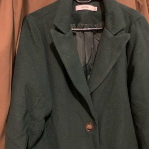 Woman’s green-teal wool coat